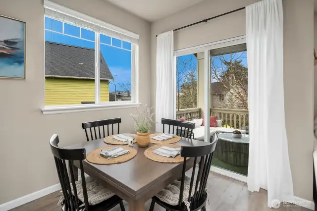 Dining area features a sliding glass door that opens to private deck.