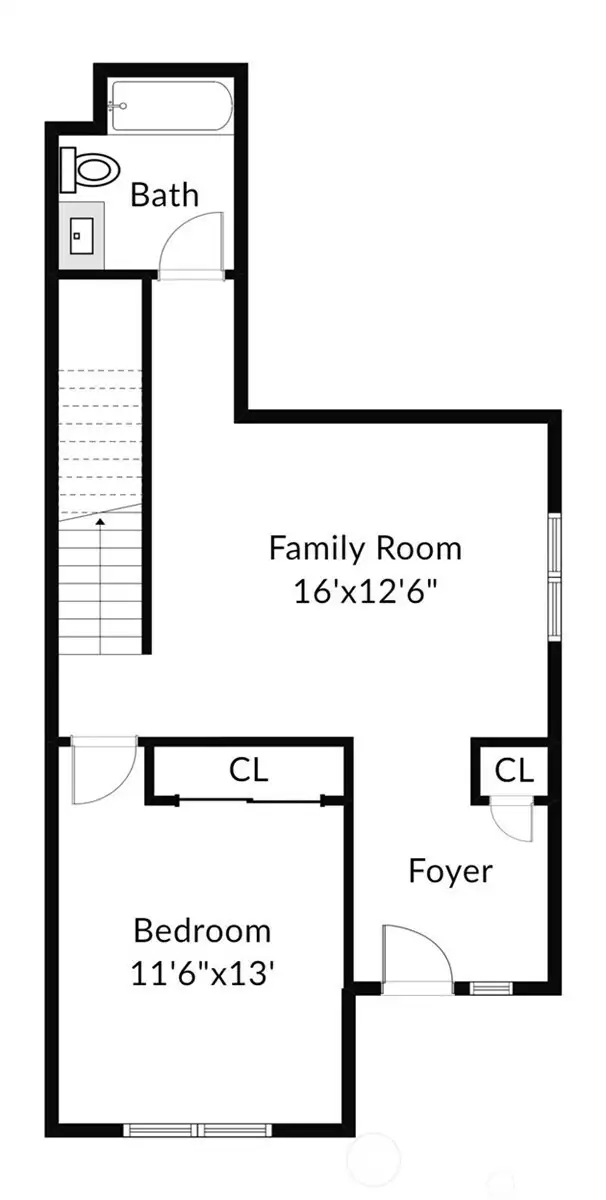Lower level of home showing foyer/entry, family room, bedroom, full bathroom and stirs leading to main level.