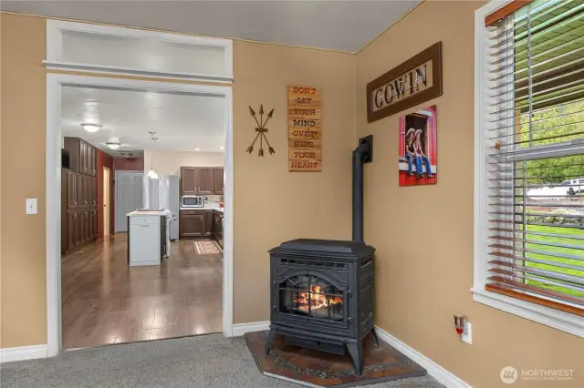 Cozy fireplace is nestled in the corner of the Living Room.