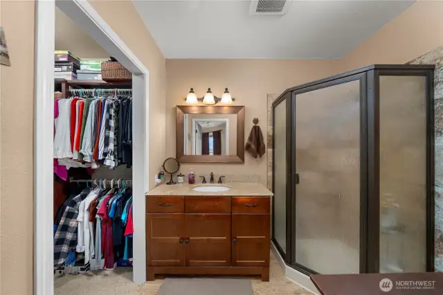 En-suite Bath features corner shower and access to a large walk-in closet.