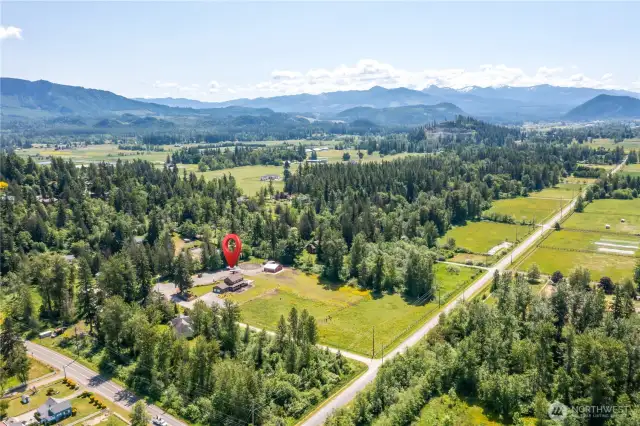 Want to be close to skiing, hiking, and Mount Rainier? Come visit this Enumclaw horse and cattle property.
