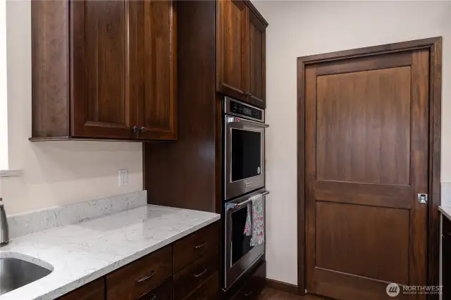 All kitchen cabinets are cherry. Double Oven.