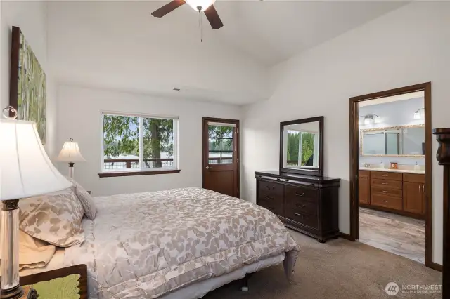 Primary bedroom with private deck and large 5 piece bathroom.