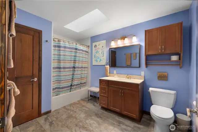 Guest bathroom - Alder cabinets and Quartz. tub/shower combo.  More storage!
