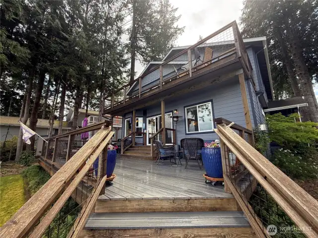 Stairs leading up to the large trex deck with ample seating and gas plumbed BBQ.
