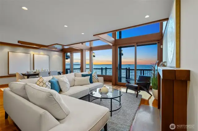 Inviting living space with panoramic water views and warm clear cedar wood details that add natural elegance.
