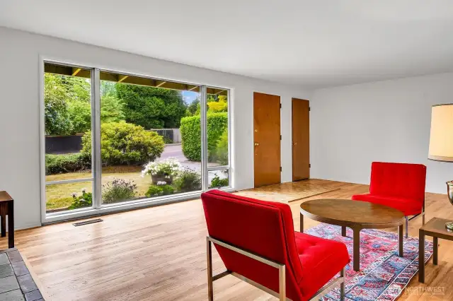 Spacious livingroom has recently redone hardwood floor