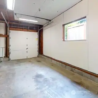 Single garage attached to south side of house