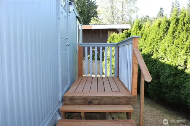Back deck with newer door.