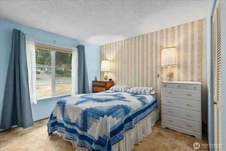 Main bedroom features a walk-in closet and offers direct access to the bathroom.