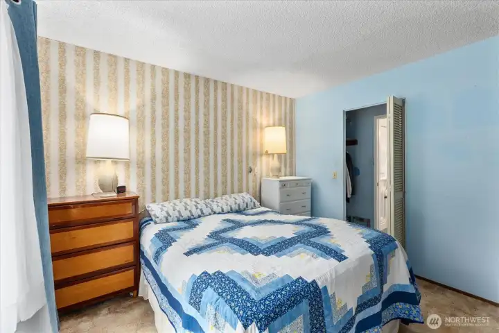 Main bedroom features a walk-in closet and offers direct access to the bathroom.