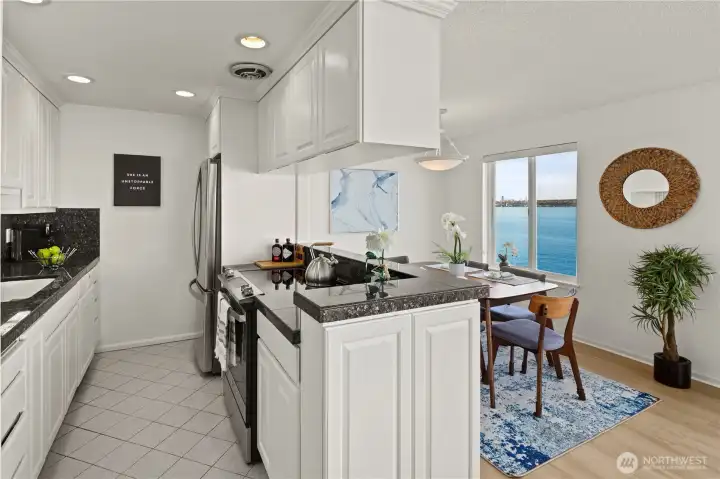 Everything is within easy reach in the kitchen with granite counter tops, new fridge and stove/oven.