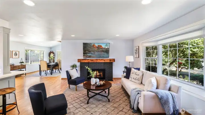 Enter to beautiful hardwood floors throughout the main level and walls of window flooding the space with an abundance of natural light.