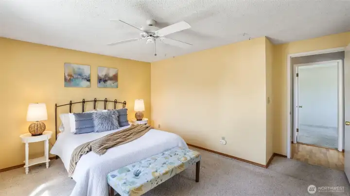 Relax in your spacious upstairs primary bedroom at the end of a long day.