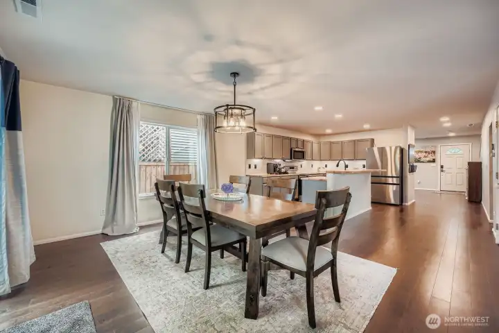 Dining area looking back at open concept kitchen