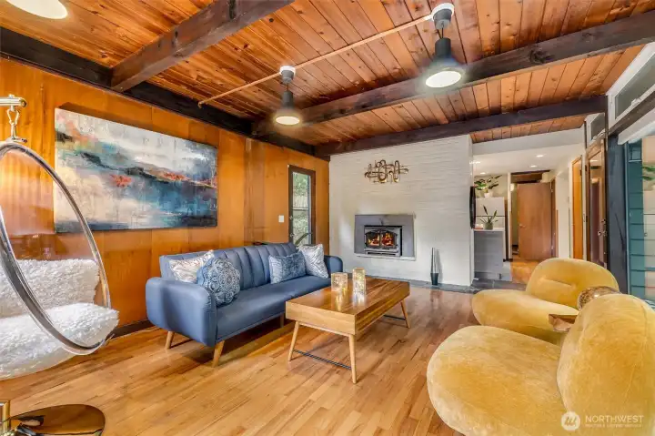 The hardwood floors, cozy fireplace, and stunning forest views really make this home feel special.