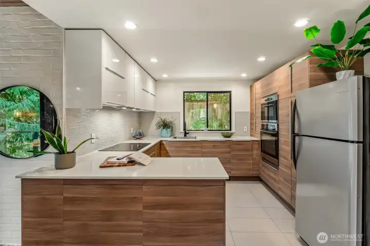 The kitchen has been thoughtfully opened up and updated, creating a more inviting space.