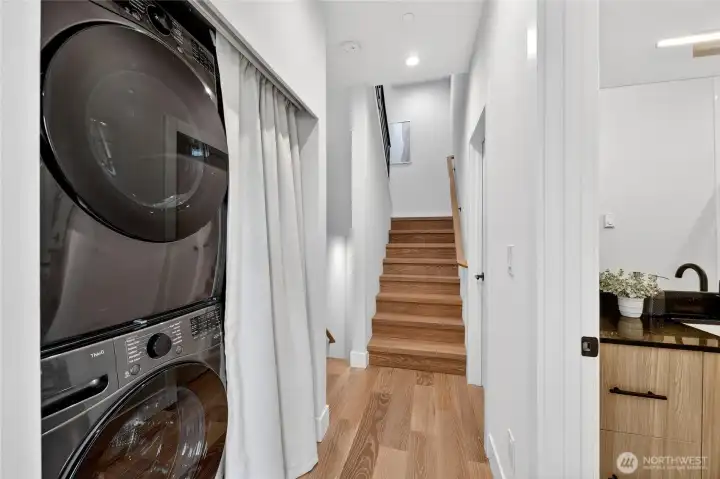 Full Sized Washer and Dryer with Bells and Whistles.  Stairway Leading to Your Envious Rooftop Deck.