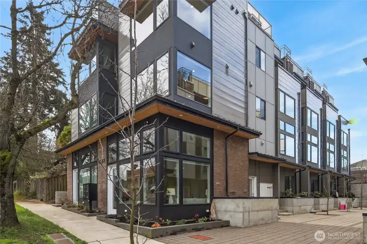 End Corner Unit with Street Front Studio that You Can Rent Out, or Build Your Business!