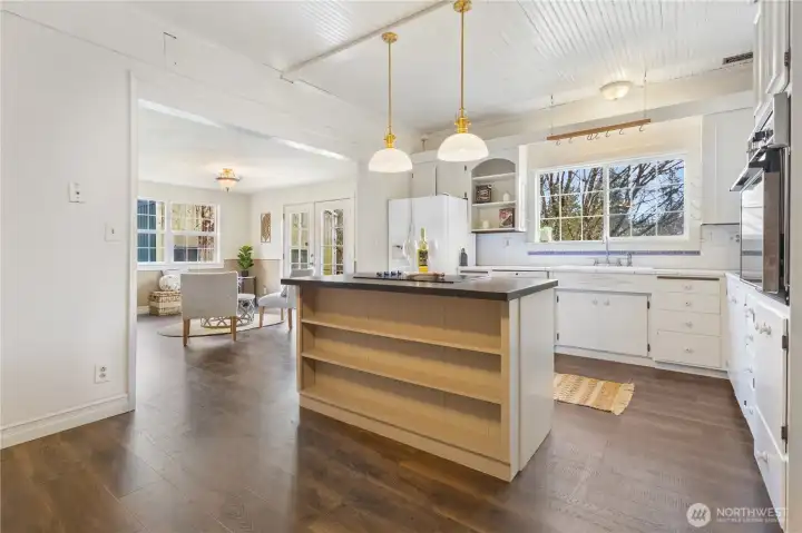 Island in kitchen with built-in shelves