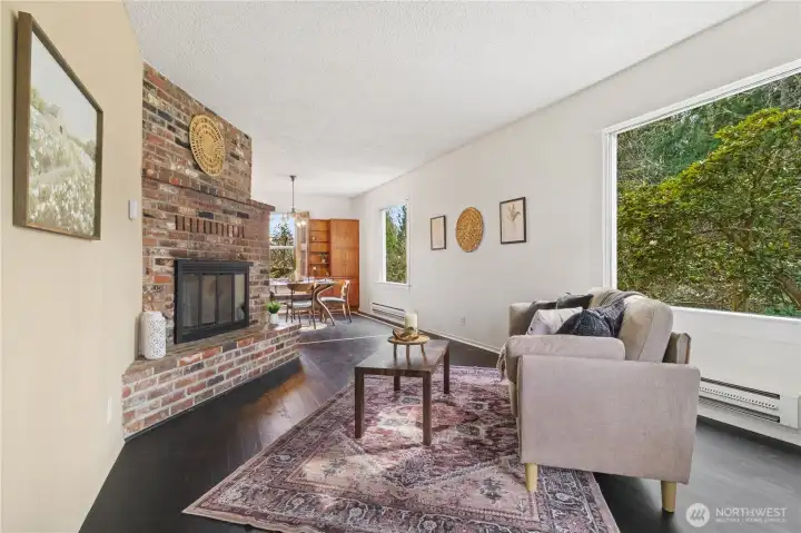 Living room with brick wood burning fireplace