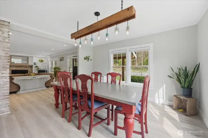 Expansive dining room great for entertaining guests. The light fixture pictured will not stay in the home.