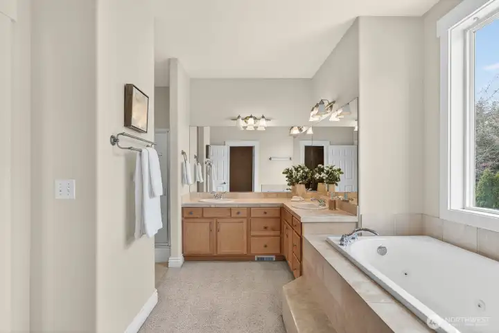 Unwind in the primary bath featuring a spacious garden tub designed for relaxation