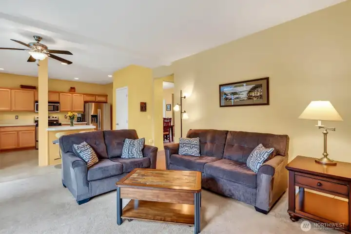 Open-concept living at its best—warm, inviting, and private with a natural flow into the kitchen.