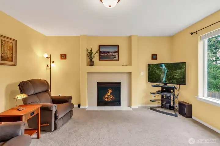 Uncommon and truly special, the primary suite features a private sitting area with backyard views and a gas fireplace, creating the perfect space to relax and recharge.