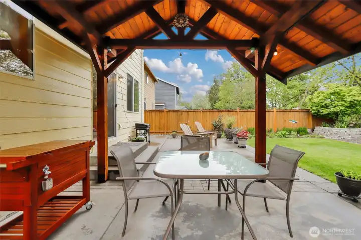 A newer (2019) covered patio creates the perfect space for outdoor living and entertaining.