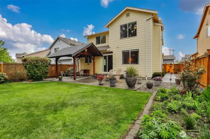 Enjoy a beautifully landscaped, fully fenced backyard that offers exceptional privacy and a south-facing exposure.