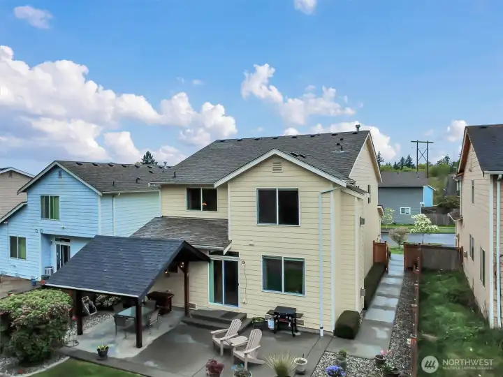 Professionally landscaped yard with easy access between front and back.