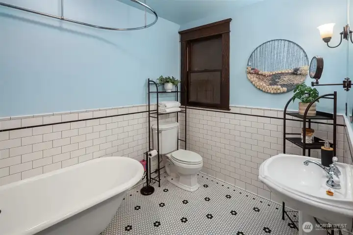 the charming full bathroom is complete with a claw foot tub. the charming full bathroom is complete with a claw foot tub.