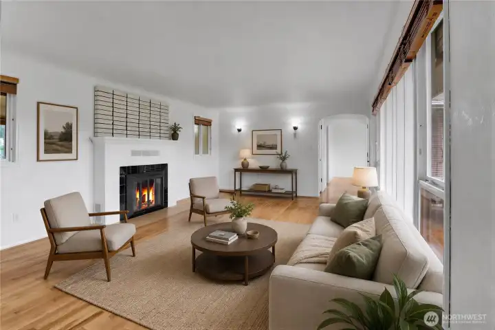 Virtually Staged Living room with hardwood floors, wood burning fireplace, and fresh paint!