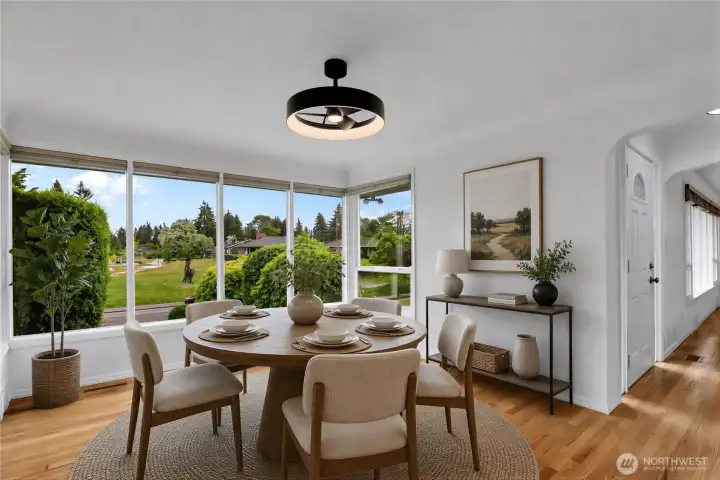 Virtually Staged Dining room with hardwood floors, updated fixtures and fresh paint!