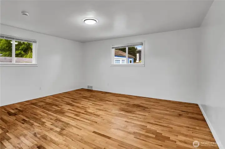 Second bedroom on main level with hardwood floors and fresh paint!