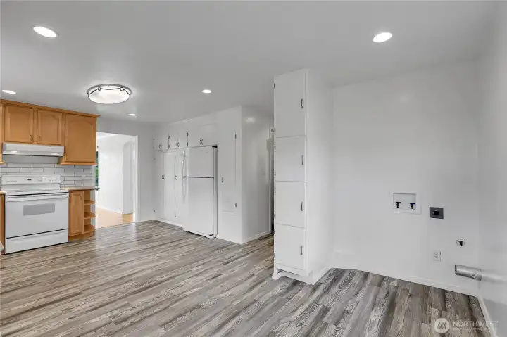 Kitchen on main level with LVP flooring and fresh paint. Washer and dryer hookup.