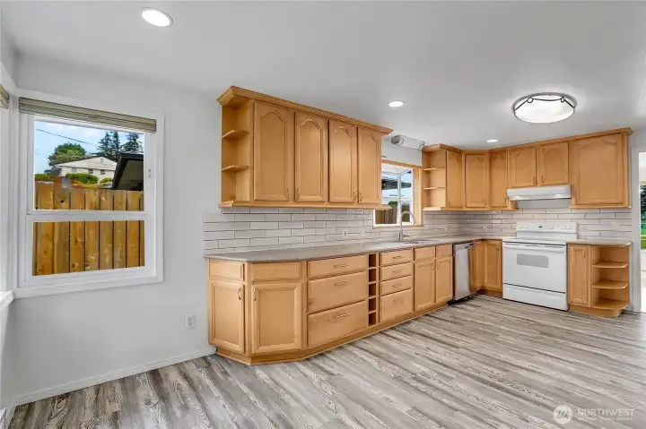 Kitchen on main level with LVP flooring and fresh paint. All appliances stay!