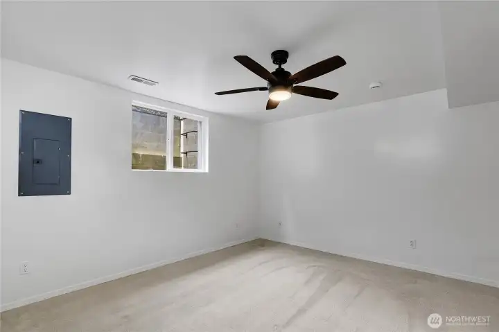 Third bedroom on lower level with fresh paint and updated fixtures