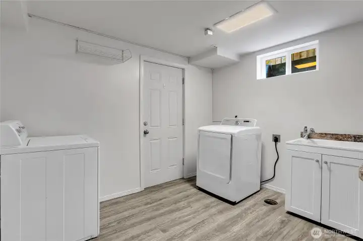 Utility room on lower level- all appliances stay!