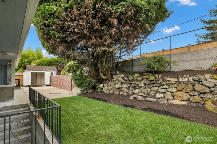 Access stairs to fenced backyard from lower level