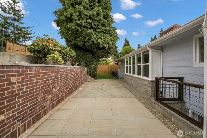 Low maintenance backyard with shed and access to additional parking!