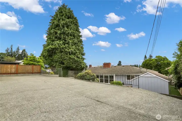 Ample parking in large parking area off alley