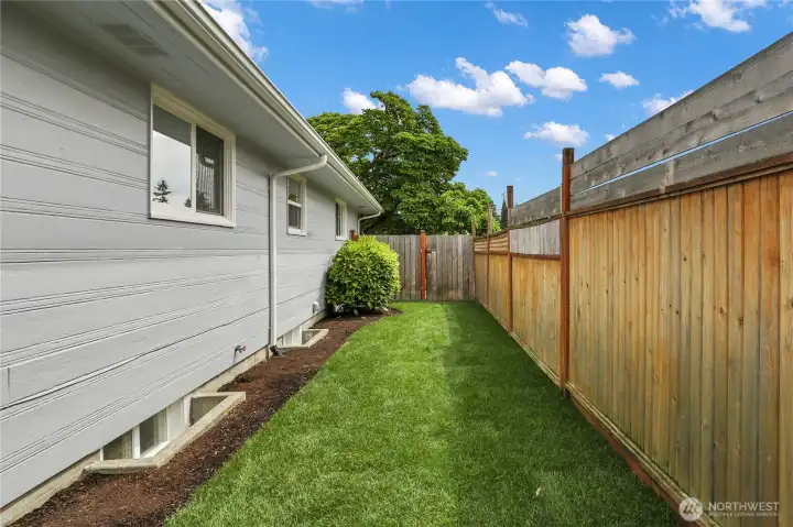 Lush grass on either side of home!