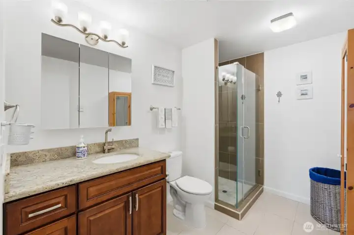 Guest bathroom has been completely updated with a tile walk-in shower, tile floors, new vanity, etc.