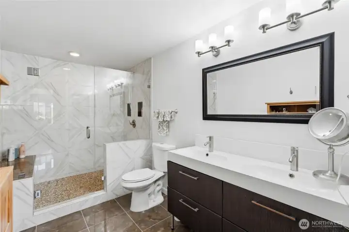 Same goes for the en-suite bath with high end finishes and a double vanity.