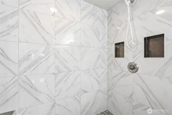 Beautifully done walk-in tile shower.