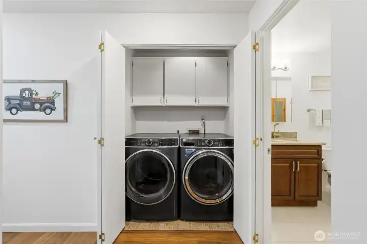 Newer Washer & Dryer centrally located between both bedrooms.
