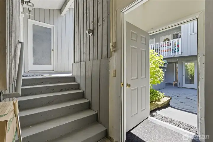 One of two outdoor storage closets to the left and zero step entry to the condo from the garage on the right.