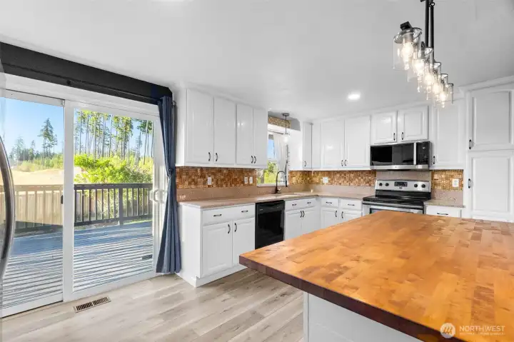 Butcher block island and refreshed cabinents Butcher block island and refreshed cabinents